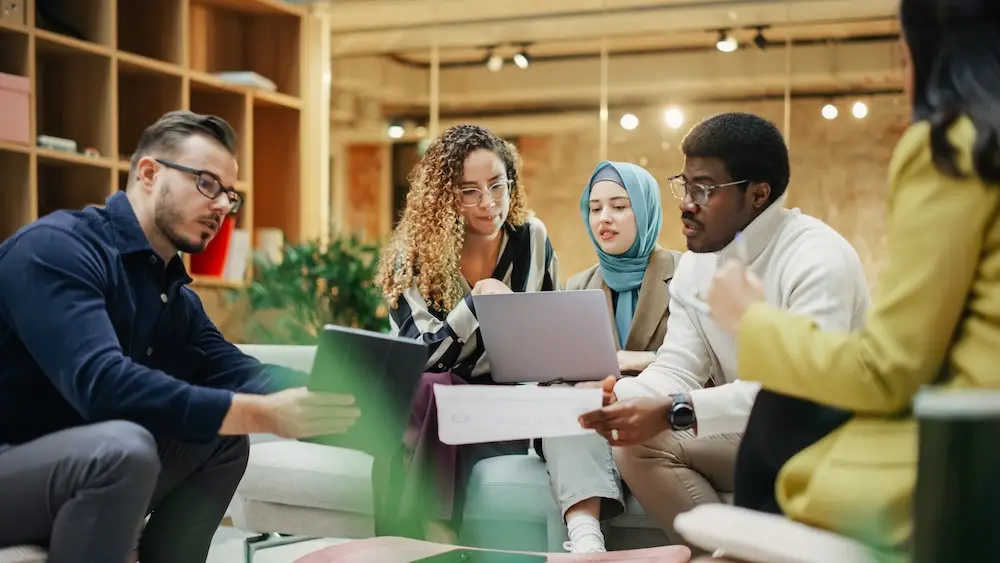 A group of multicultural and diverse races working in an office space